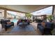 Patio with outdoor seating around the pool at 16036 W Desert Bloom St, Goodyear, AZ 85338