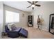 Bedroom with a ceiling fan and bookshelf at 16036 W Desert Bloom St, Goodyear, AZ 85338