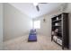 Bedroom with a ceiling fan and shelving at 16036 W Desert Bloom St, Goodyear, AZ 85338