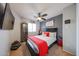 Bedroom features a sleek ceiling fan, dark accent wall, and well-placed decor at 16036 W Desert Bloom St, Goodyear, AZ 85338