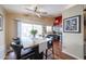 Open dining area with modern table, stylish chairs, and sliding glass doors at 16036 W Desert Bloom St, Goodyear, AZ 85338