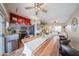 Open concept kitchen and dining area with stainless steel appliances and ample lighting at 16036 W Desert Bloom St, Goodyear, AZ 85338