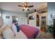 Comfortable main bedroom with ceiling fan, walk-in closet, and ensuite bathroom at 16036 W Desert Bloom St, Goodyear, AZ 85338