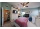The main bedroom offers a ceiling fan and an ensuite bathroom at 16036 W Desert Bloom St, Goodyear, AZ 85338