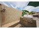Modern outdoor kitchen featuring a stainless steel grill and ample counter space for meal preparation at 16036 W Desert Bloom St, Goodyear, AZ 85338