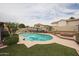 Refreshing pool with a nearby fire pit and ample lounge space, perfect for entertaining at 16036 W Desert Bloom St, Goodyear, AZ 85338