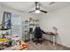 Bright room features modern desk area, display shelving, and plush carpet at 17461 W Molly Ln, Surprise, AZ 85387
