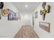 Hallway with new laminate flooring and fresh paint throughout the home at 17461 W Molly Ln, Surprise, AZ 85387