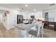 Bright, updated kitchen with granite countertops, white cabinets, and stainless steel appliances at 17461 W Molly Ln, Surprise, AZ 85387