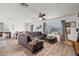 Spacious living room featuring wood-look floors, neutral paint, and lots of natural light at 17461 W Molly Ln, Surprise, AZ 85387
