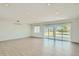 Bright and spacious living room with sleek flooring and sliding glass doors to the backyard at 1930 E Missouri Ave, Phoenix, AZ 85016
