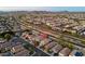 Real estate aerial view of a home, pinpointed in a suburban neighborhood with mountain views at 22259 N 102Nd Ln, Peoria, AZ 85383