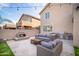 Lush backyard featuring an outdoor living area, built-in fireplace, and grilling area at 22259 N 102Nd Ln, Peoria, AZ 85383