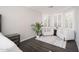 Cozy bedroom seating area with accent chairs and plantation shutters at 22259 N 102Nd Ln, Peoria, AZ 85383