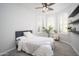 Bedroom with ceiling fan, plantation shutters and stylish decor at 22259 N 102Nd Ln, Peoria, AZ 85383