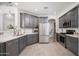 Beautiful, modern kitchen featuring stainless steel appliances and two-tone cabinets at 22259 N 102Nd Ln, Peoria, AZ 85383