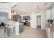 Spacious kitchen with breakfast bar, stainless steel appliances, and stylish pendant lighting at 22259 N 102Nd Ln, Peoria, AZ 85383