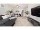 Comfortable living space with a dining area, plush seating, and a modern television setup at 22259 N 102Nd Ln, Peoria, AZ 85383