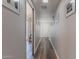 Entry hallway featuring wood-look floors, neutral paint, and access to the living spaces at 2326 E Evans Dr, Phoenix, AZ 85022