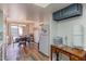 An open-concept kitchen with white appliances, a wooden desk, and views into the dining area at 2326 E Evans Dr, Phoenix, AZ 85022