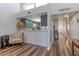 Open kitchen area with bar seating and views of the living room and hallway at 2326 E Evans Dr, Phoenix, AZ 85022