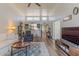 Spacious living room with high ceilings, hardwood floors, and a view into the kitchen at 2326 E Evans Dr, Phoenix, AZ 85022