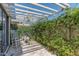 A cozy patio area covered in vines with a white rocking chair and chandelier at 2326 E Evans Dr, Phoenix, AZ 85022