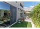 Relaxing outdoor patio with a white pergola, green plants, and ample seating creating a charming and serene space at 2326 E Evans Dr, Phoenix, AZ 85022
