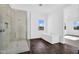 Bright bathroom features a standalone tub and tiled walk-in shower at 24138 S 220Th St, Queen Creek, AZ 85142