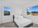 Bright bedroom boasts two windows with an exterior view at 24138 S 220Th St, Queen Creek, AZ 85142