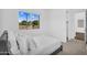 Bright bedroom with natural light offers a large window and an attached doorway at 24138 S 220Th St, Queen Creek, AZ 85142