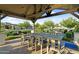 Community area with an outdoor kitchen, gas grill and dining area at 24138 S 220Th St, Queen Creek, AZ 85142
