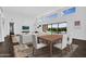 Open-concept dining area with stylish furniture and views of the outdoor pool at 24138 S 220Th St, Queen Creek, AZ 85142