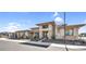 Gorgeous stucco home with stone details and tidy landscaping in a desert community at 24138 S 220Th St, Queen Creek, AZ 85142