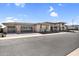 A luxury home featuring a spacious three-car garage and stone accents for enhanced curb appeal at 24138 S 220Th St, Queen Creek, AZ 85142