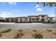 Beautiful single-Gathering home featuring a spacious three-car garage and drought-resistant landscaping at 24138 S 220Th St, Queen Creek, AZ 85142