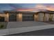 Oversized two-car garage with clear glass panel doors at 24138 S 220Th St, Queen Creek, AZ 85142