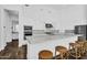 Bright kitchen features a large island with counter seating and modern stainless steel appliances at 24138 S 220Th St, Queen Creek, AZ 85142