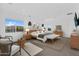 Spacious main bedroom with neutral tones, bench seating, and lots of natural light at 24138 S 220Th St, Queen Creek, AZ 85142