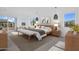 Spacious main bedroom with neutral tones, bench seating, and lots of natural light at 24138 S 220Th St, Queen Creek, AZ 85142