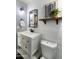 Charming bathroom featuring a modern vanity, shiplap walls, and decorative accents at 2709 E Vista Dr, Phoenix, AZ 85032