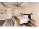 Cozy bedroom featuring a ceiling fan, wood-look floors, and soft, neutral decor at 2709 E Vista Dr, Phoenix, AZ 85032