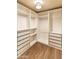 Walk-in closet with custom built-in shelves and drawers at 2709 E Vista Dr, Phoenix, AZ 85032