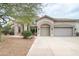 Beautiful two-story home with a three-car garage and desert landscaping at 2709 E Vista Dr, Phoenix, AZ 85032