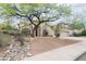Charming single-story home boasts mature landscaping and a desert-style rock garden feature at 2709 E Vista Dr, Phoenix, AZ 85032