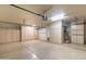 This spacious garage features plenty of storage cabinets and space for multiple vehicles at 2709 E Vista Dr, Phoenix, AZ 85032