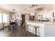 Open kitchen showcasing stainless steel appliances, white cabinets, a spacious island and barn door at 2709 E Vista Dr, Phoenix, AZ 85032