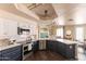 Bright kitchen showcasing stainless steel appliances, quartz countertops and eat-in dining area at 2709 E Vista Dr, Phoenix, AZ 85032