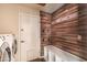 Laundry room with a utility sink and built-in bench at 2709 E Vista Dr, Phoenix, AZ 85032