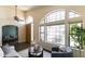 Open living area showcasing large windows, wood floors, and a comfortable seating arrangement at 2709 E Vista Dr, Phoenix, AZ 85032